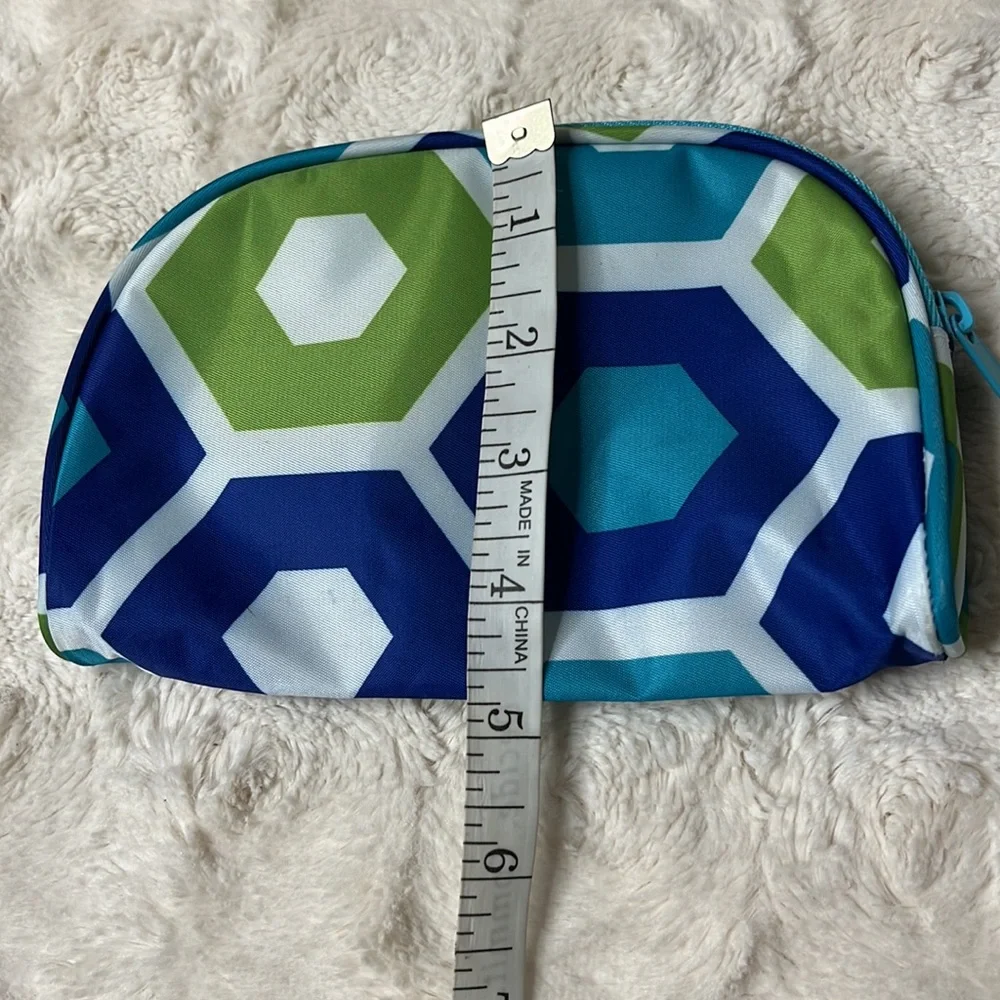 Small cosmetic bag with zip top closure.